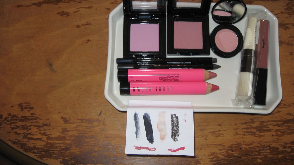 Purchases: Blush in Nude Pink and Desert Pink; Long Wear Eye Pencil in Black Navy and Mahogany.  Freebies: the mini Illuminating Bronzer in Antigua; brush; Nude lip gloss; Art Stick Duo in Dusty Pink and Electric Pink.  Swatches from L-R: Eye Pencil Black Navy, (light and heavy swatch,)  Illuminating Balm Golden Glow; Eye Pencil in Mahogany; Art Stick Dusty Pink; Art Stick Electric Pink