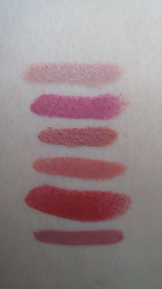 From top to bottom: elf in Natural, KVD in Mother, Marc Jacobs Liquid Lip Crayon in Night Mauves, Tom Ford in Indian Rose, KVD in Hexagram and Bareminerals liquid lipstick in Juju