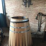 Here is a pic of the wine barrel being built. They need to use fresh wood to make sure the wine flavor isn't altered unexpectedly and have to match up boards perfectly like a puzzle to get a snug barrel.