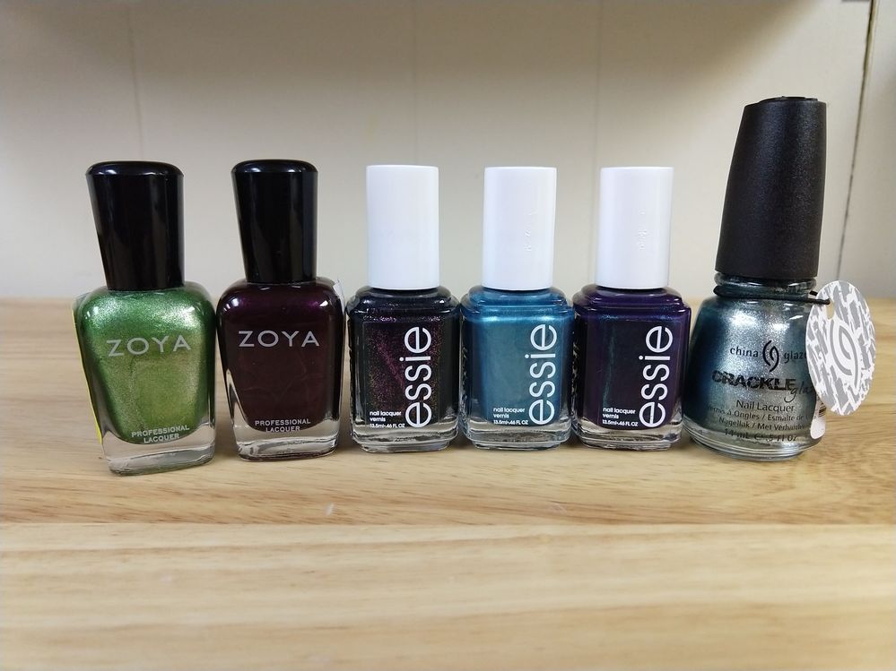 L to R: Zoya Meg, Zoya Sloane, Essie Haute Tub, Essie Beach Bum Blu, Essie Dressed to the Nineties, China Glaze Crackle Glaze in Oxidized Aqua