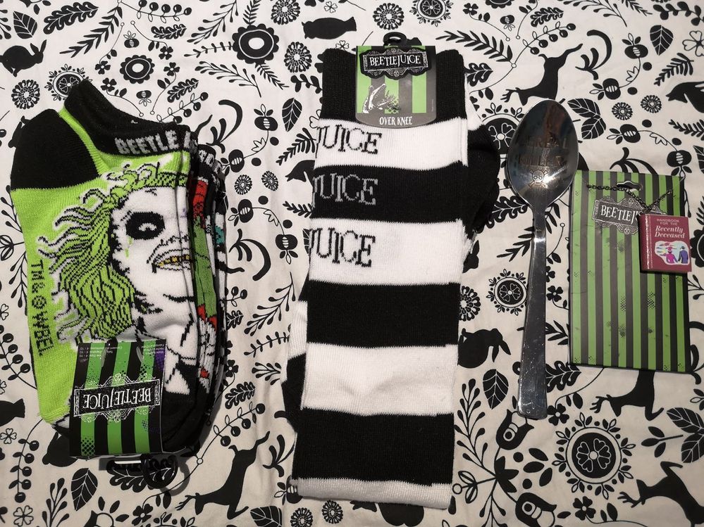 The socks are so cute!!! I wanted to dress up as Beetlejuice for Halloween this year, but I couldn't find anything for an outfit. The long socks will be perfect! The handbook necklace is adorable!