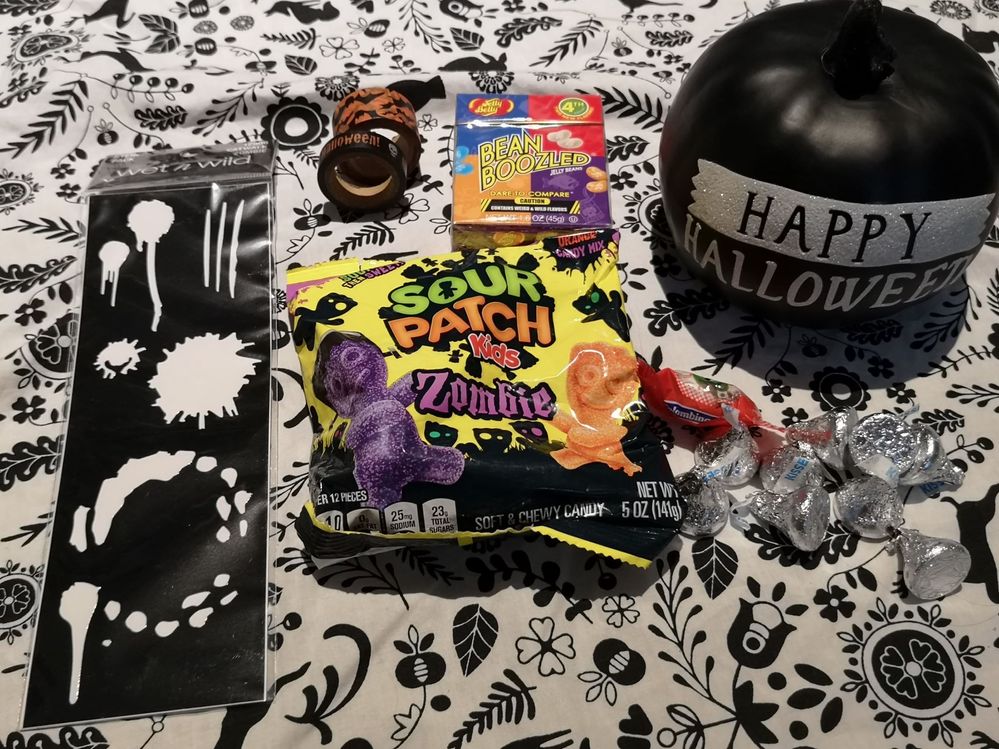 Last, but not least, lots of candy, some fun washi tape, the cutest  glittery pumpkin and some zombie makeup stencils!! I may have already started eating all of the candy.