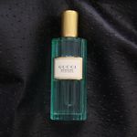 Image of Gucci Memoire d'une Odeur Eau de Parfum bottle against a black background.JPG