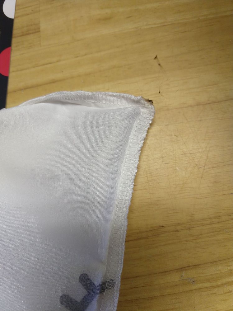 Sharp plastic edge after burning, with a plastic "string" from the melted plastic sticking to my finger when I touched it