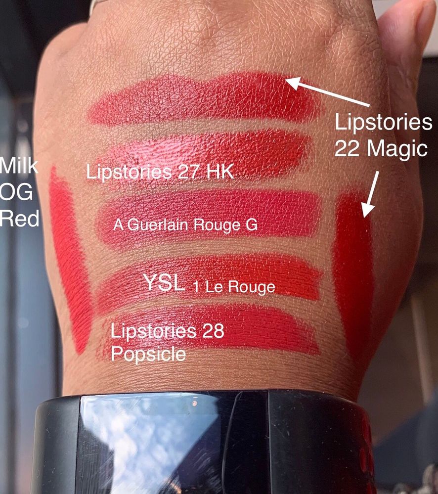 Red lipstick swatches; daylight through a window inside Sephora.
