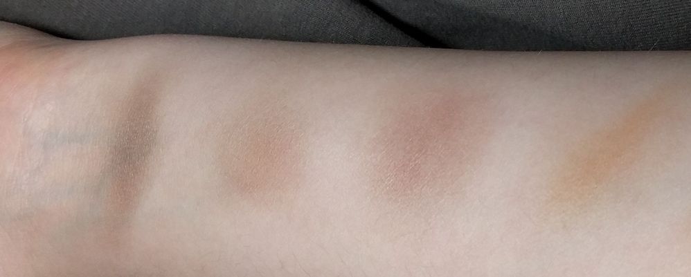 In order from left to right: Maybelline Tough as Taupe, Ben Nye Contour No. 1, NYX Taupe (square case), Too Faced Milk Chocolate Soliel