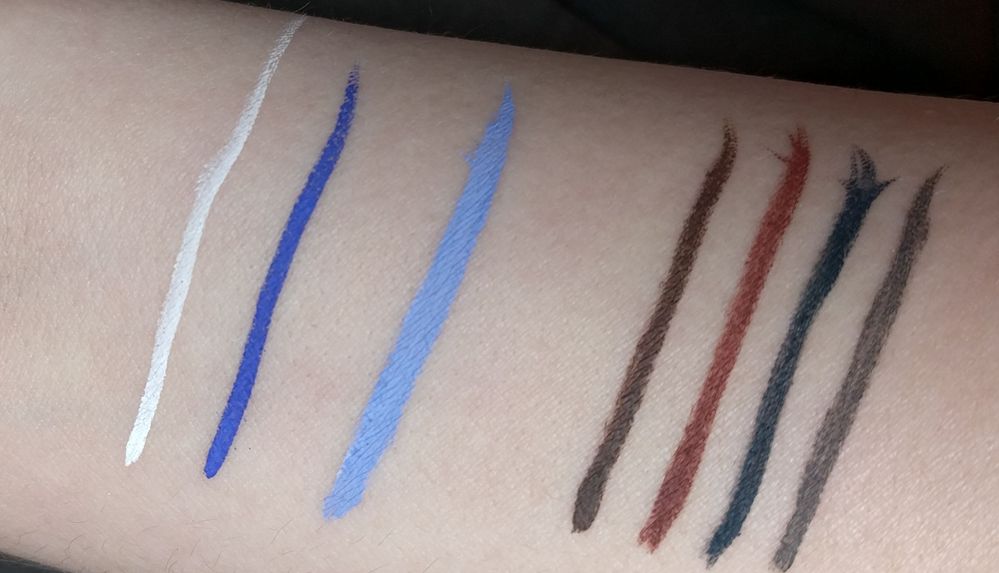 From left to right: Ben Nye White, Ben Nye Electric Blue, Ben Nye White and Electric Blue mixed, the colors from the Kryolan Standard 1 set in palette order
