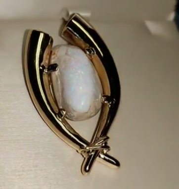 His tusks with opal