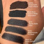 Swatches of 5 matte black lipsticks. One is clearly deeper in the void than the others. :D