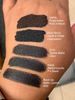 Swatches of 5 matte black lipsticks. One is clearly deeper in the void than the others. :D