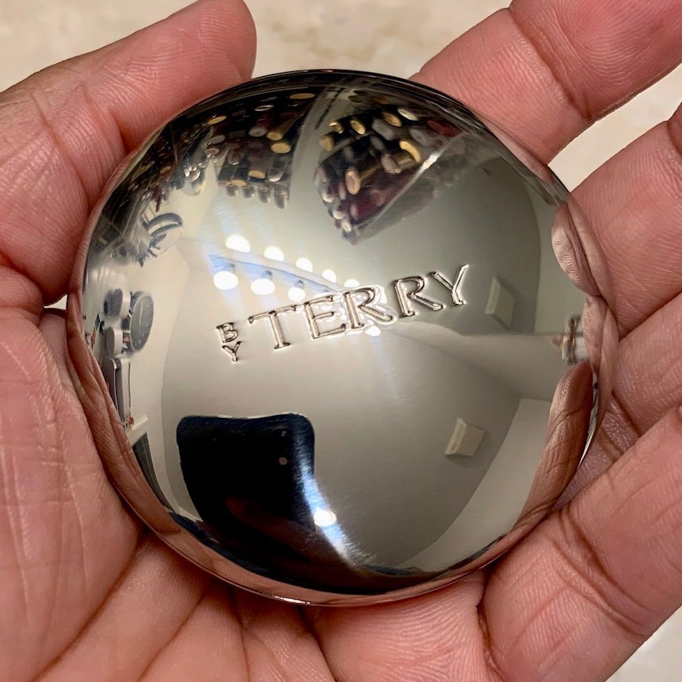 This is my powder foundation compact. It’s heavy for its size, but I like that for this product. It’s nice to hold in one hand, almost like a worry stone.