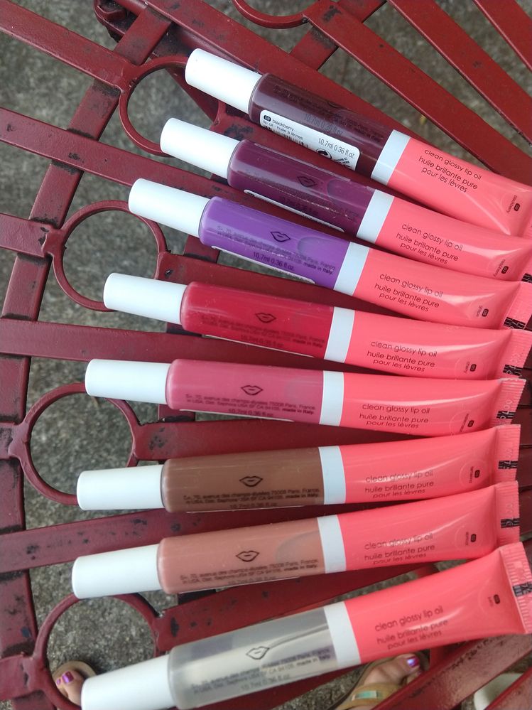 Clean Glossy Lip Oil, shades bottom to top: 01 Juicy, 02 Apricot, 03 Tamarind, 04 Watermelon, 05 Cherry, 06 Grape, 07 Raspberry, 08 Blackberry