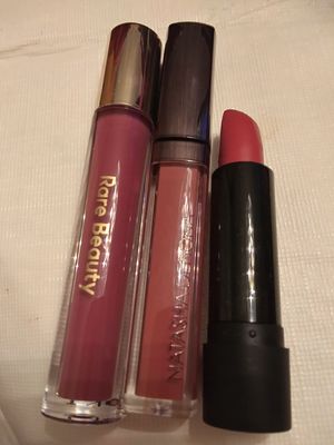 Rare Beauty Stay Vulnerable Glossy Lip Balm in Nearly Mauve; Natasha Denona Mark Your Liquid Lips in 24 Dahlia; Melt Lipstick Lucretia