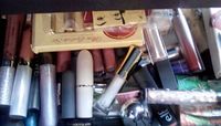 mass drawer of lipsticks and glosses