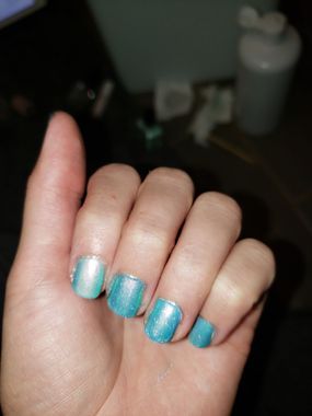 Definitely much more teal now, awesomely sparkly in person. Index finger has the matte top coat, it didn't improve it much, just made it lighter and less fun