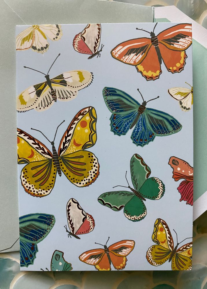 The gold embossed butterflies are so spring-y!
