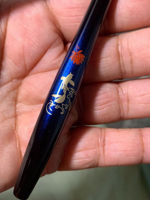 Closeup of a Summer Koi brush handle.