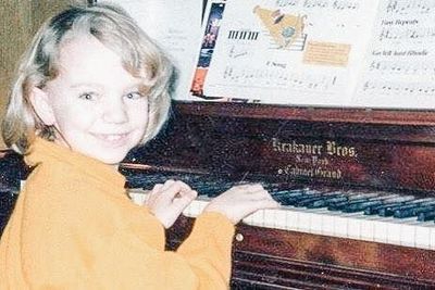 Me and the piano around 5 and proof my hair is not naturally straight.