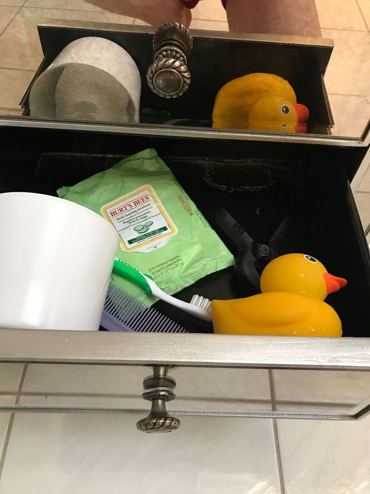 Baby hearts has his own drawer to keep him occupied in my beauty room.  See that nice white substance?  That's dried milk from the bottle I just found in there.  Sigh.  Gotta check it more often.