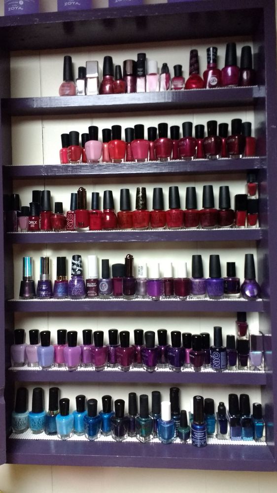 The cabinet holds pinks, reds, purples, and blues that have been used one or more times