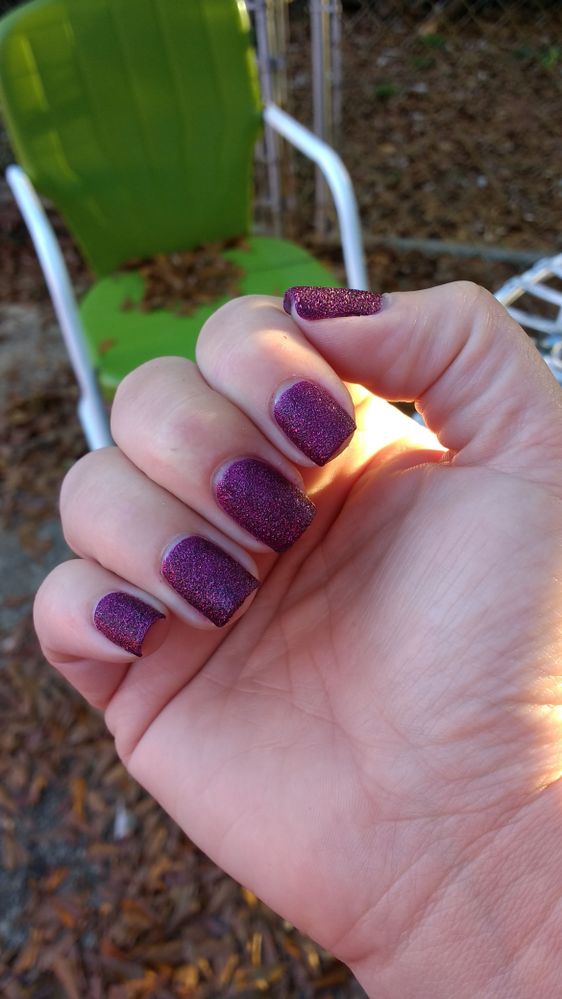 Bright daylight, shaded. The finish is relatively matte, and it's hard to tell there's sparkle in there