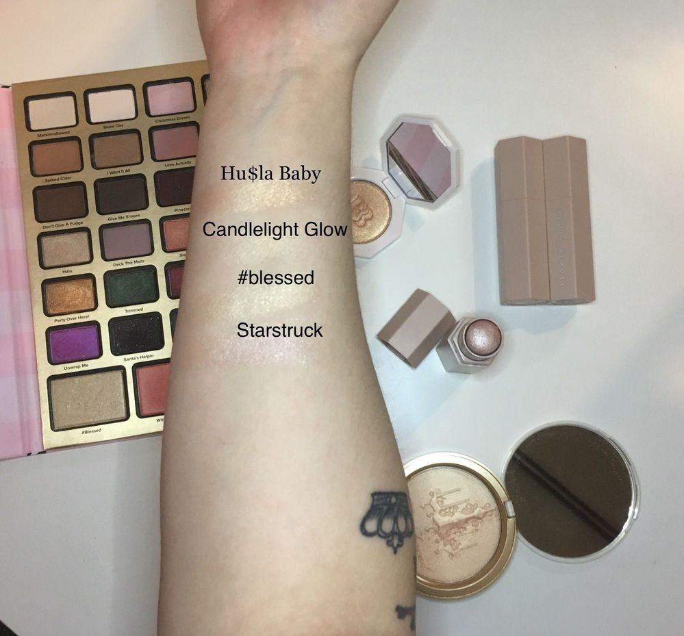 Swatches of Hu$la Baby by Fenty, candlelight glow by Too Faced, #blessed by Too Faced, and Starstruck matchstick highlight by Fenty
