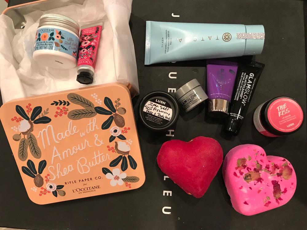 Tatcha pore perfecting sunscreen, Glamglow promo, LUSH The Kiss Lip Scrub, Tisty Tosty Bath Bomb, Whole Lotta Love Bubblebar, L'occitane Rifle Paper Co.