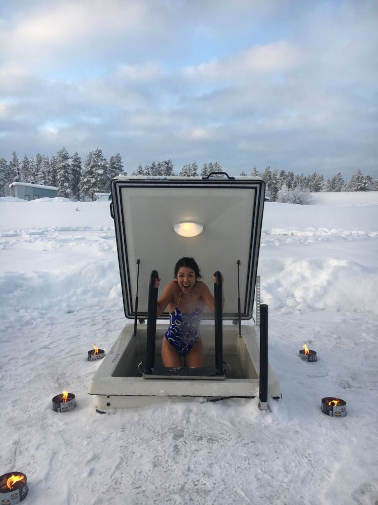 Brave Gaby jumping into the ice pond after the hot sauna-- a traditional Finnish routine!