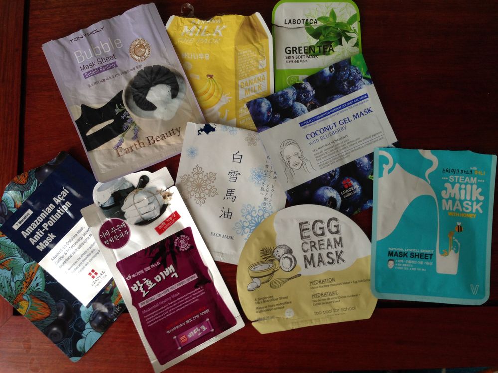 TonyMoly Bubble Mask Sheet; A’pieu Banana Milk; Leaders Labotica Green Tea Skin Soft Mask; Leaders 7 Wonders Amazonian Acai Anti-Pollution Mask; Bidanpo Mediental Healing Mask; Hokkaido Coroku White Snow Fairy Face Mask; Too Cool For School Egg Cream Mask; Leaders Coconut Gel Mask with Blueberry; Company V Steam Milk Mask with Honey (not sure if the “V” in the name refers to the letter “V” or the Roman numeral for “5”)